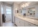 Updated bathroom with granite vanity, large mirror, and spacious shower at 1673 Nash Ct, Dunedin, FL 34698