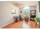 Charming dining area with hardwood floors and window seat at 1673 Nash Ct, Dunedin, FL 34698
