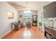 Cozy dining area with hardwood floors and window seat at 1673 Nash Ct, Dunedin, FL 34698