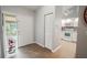 Bright entryway with view into kitchen and backyard at 1673 Nash Ct, Dunedin, FL 34698