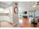 Open kitchen with white cabinets and granite countertops at 1673 Nash Ct, Dunedin, FL 34698