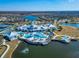 Aerial view of resort-style pool and surrounding community at 19381 Ship Wheel Way, Land O Lakes, FL 34638