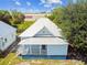 Single story light blue house with a metal roof, and a small yard at 2314 E 12Th Ave, Tampa, FL 33605