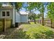Side of house and fenced backyard with grassy area at 2314 E 12Th Ave, Tampa, FL 33605