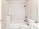 Updated bathroom with marble tile shower and white toilet at 2314 E 12Th Ave, Tampa, FL 33605