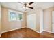Bedroom featuring hardwood floors, ceiling fan, and double door closet at 2314 E 12Th Ave, Tampa, FL 33605