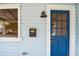 Blue front door with a white frame and glass panels at 2314 E 12Th Ave, Tampa, FL 33605
