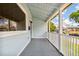 Bright front porch with white railings and a view of the neighborhood at 2314 E 12Th Ave, Tampa, FL 33605