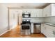 Modern kitchen with stainless steel appliances and hardwood floors at 2314 E 12Th Ave, Tampa, FL 33605