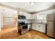 Kitchen features stainless steel appliances and hardwood floors at 2314 E 12Th Ave, Tampa, FL 33605