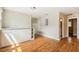 Small kitchenette, white cabinets, granite countertop, and wood flooring at 2314 E 12Th Ave, Tampa, FL 33605