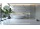Elegant bathroom with marble finishes, a freestanding tub, and large windows at 2414 N Riverside Dr, Tampa, FL 33602