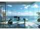 Modern home office with panoramic ocean views and sleek glass walls at 2414 N Riverside Dr, Tampa, FL 33602