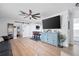 Living area with light wood floors and a stylish console at 246 43Rd Ne Ave, St Petersburg, FL 33703