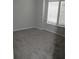 Spacious bedroom with grey carpet and large windows at 3737 Yardarm Dr, Tampa, FL 33611