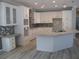 Modern kitchen featuring white cabinets, granite countertops, and an island at 3737 Yardarm Dr, Tampa, FL 33611