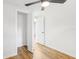 Bedroom with light wood floors, ceiling fan and spacious closet at 4215 E Paris St, Tampa, FL 33610