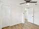 Spacious bedroom with wood floors, ceiling fan, and plenty of closet space at 4215 E Paris St, Tampa, FL 33610