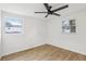Bright bedroom with light wood floors and two windows at 4215 E Paris St, Tampa, FL 33610