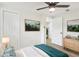 Charming bedroom with wood floors, a ceiling fan, and stylish decor at 4215 E Paris St, Tampa, FL 33610