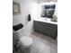 Modern bathroom with gray vanity and updated fixtures at 434 29Th N Ave, St Petersburg, FL 33704