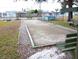 Outdoor bocce ball court with benches and landscaping at 4343 Tahitian Gardens Cir # G, Holiday, FL 34691