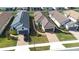 Community view showcasing several homes with tile roofs and landscaping at 4639 Garofalo Rd, Wesley Chapel, FL 33543