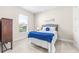 Bright bedroom with a queen-size bed and ample natural light at 4639 Garofalo Rd, Wesley Chapel, FL 33543