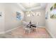 Bright dining room with chandelier and pink rug at 4639 Garofalo Rd, Wesley Chapel, FL 33543