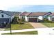 Single-story home with tile roof, two-car garage, and landscaped front yard at 4639 Garofalo Rd, Wesley Chapel, FL 33543
