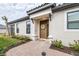 Inviting front entrance with a brown door and a stylish wreath at 4639 Garofalo Rd, Wesley Chapel, FL 33543