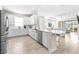 Open concept kitchen with stainless steel appliances and island at 4639 Garofalo Rd, Wesley Chapel, FL 33543