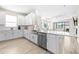 Open concept kitchen with stainless steel appliances and island at 4639 Garofalo Rd, Wesley Chapel, FL 33543