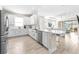 Modern kitchen with white cabinets, stainless steel appliances, and island at 4639 Garofalo Rd, Wesley Chapel, FL 33543