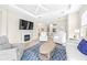 Spacious living room with a fireplace and access to the kitchen at 4639 Garofalo Rd, Wesley Chapel, FL 33543