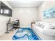 Home office with a comfortable couch and work area at 4639 Garofalo Rd, Wesley Chapel, FL 33543