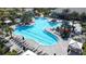 Expansive pool with lounge chairs, umbrellas, and a surrounding patio at 4639 Garofalo Rd, Wesley Chapel, FL 33543
