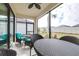 Relaxing screened patio with outdoor furniture and ceiling fan at 4639 Garofalo Rd, Wesley Chapel, FL 33543