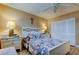 Bedroom with white bed frame, nightstand, and closet at 4780 Cove Cir # 209, St Petersburg, FL 33708