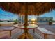 Enjoy sunset views from under a tiki hut at the community patio at 4780 Cove Cir # 209, St Petersburg, FL 33708