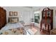 Small bedroom with twin bed and antique wooden secretary at 5063 Breakwater Blvd, Spring Hill, FL 34607