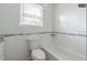 Updated bathroom with a new bathtub, toilet, and vanity at 5218 E 20Th Ave, Tampa, FL 33619