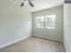 Bedroom with wood-look flooring and window at 5218 E 20Th Ave, Tampa, FL 33619