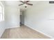 Bedroom with wood-look flooring and ceiling fan at 5218 E 20Th Ave, Tampa, FL 33619