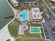 Aerial view of pool, shuffleboard, and parking at 5220 Brittany S Dr # 201, St Petersburg, FL 33715