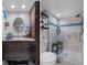 Bathroom with vanity, toilet, and walk-in shower at 5220 Brittany S Dr # 201, St Petersburg, FL 33715