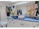 Modern bathroom with a vessel sink, blue countertop, and stylish decor at 5220 Brittany S Dr # 201, St Petersburg, FL 33715
