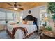 Spacious bedroom with king-size bed and ceiling fan at 5220 Brittany S Dr # 201, St Petersburg, FL 33715