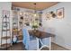 Bright dining area with built-in shelving and a dark wood table at 5220 Brittany S Dr # 201, St Petersburg, FL 33715