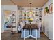 Charming dining area with built-in shelving and four chairs at 5220 Brittany S Dr # 201, St Petersburg, FL 33715